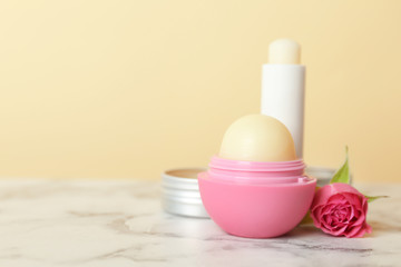 Composition with hygienic lipstick and balms on table