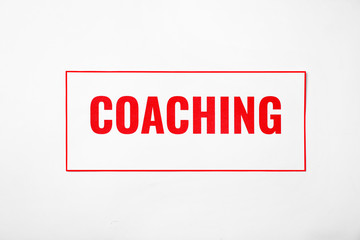 Word COACHING on white background. Business trainer concept