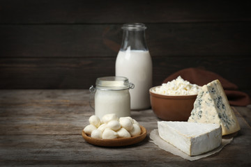 Different fresh dairy products on wooden table