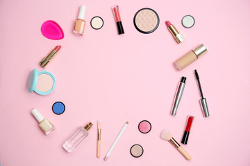 Flat lay composition with makeup products for woman on color background