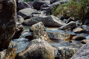 Naklejka na ściany i meble Photo of a mountain river in China among large stones.