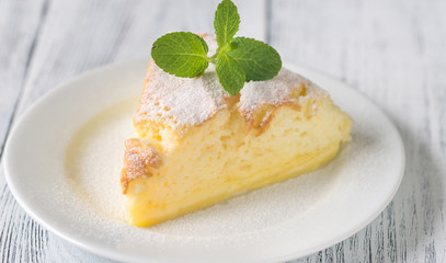 Slice of cheesecake on the white plate
