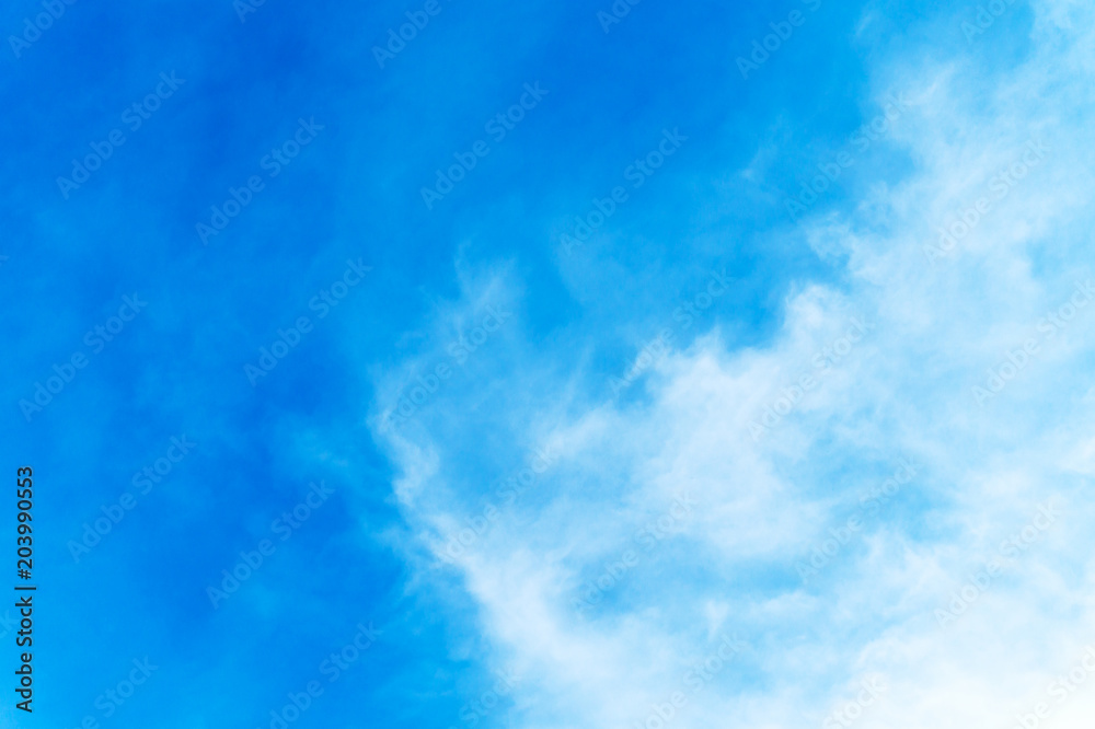 Wall mural Blue sky background with clouds for design