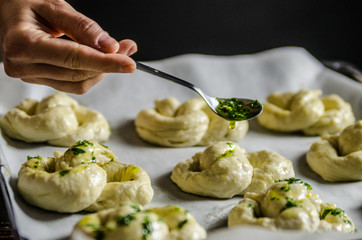 Dough dainted by the woman on the board