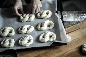 Dough dainted by the woman on the board