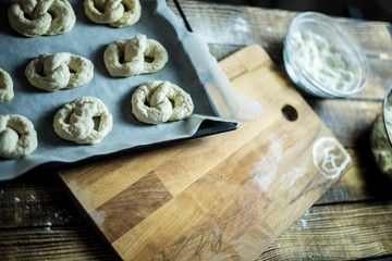 Dough dainted by the woman on the board
