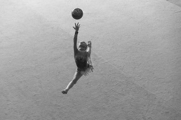 Gymnast performs before the judges in rhythmic gymnastics competition
