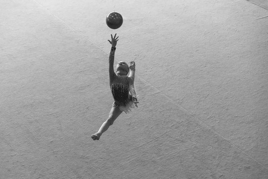 Gymnast Performs Before The Judges In Rhythmic Gymnastics Competition