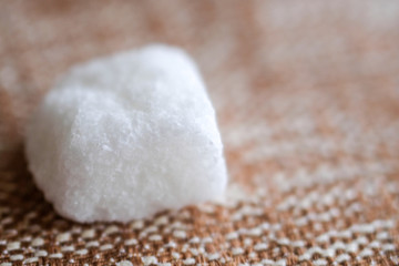 White sugar cube on surface Close up