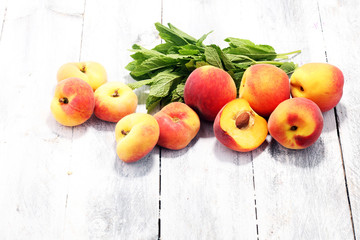 A group of ripe peaches on table