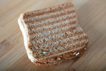 Turkish toast with cheddar on wooden background..