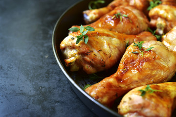 Grilled chicken legs with thyme.
