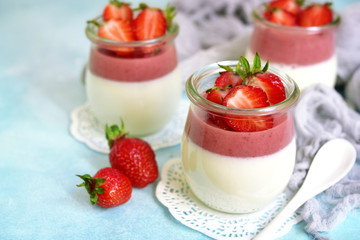 Vanilla strawberry panna cotta in a vintage jars.