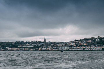 Fototapeta premium The town of Cobh , which sits on an island in Cork city’s harbour, as seen from the sea. It’s known as the Titanic’s last port of call in 1912.