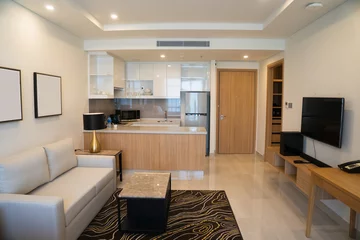 Foto op Plexiglas Modern interior design of studio apartment. Hotel room with living space and kitchen corner counter with appliances. Apartment concept © Mangostar