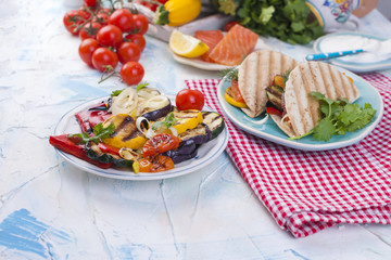 tortilla with vegetables and salmon. Fitness food. Healthy lunch. Vegetables and fish. Summer menu. Place for text
