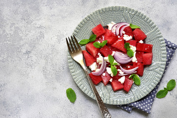 Watermelon salad with feta and red onion.Top view with space for text.