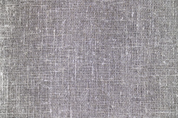 Beige fabric background texture burlap jute, flax and hemp.