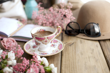 Vintage photo, fragrant coffee and women's accessories. Hat and glasses, good morning at the cafe. Planning. Text