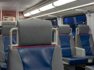 A view of a headrest on a commuter subway train with space to the right