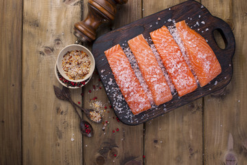Salmon steaks with large salt, lemon and spices. Preparation of tasty and healthy food. Place for text. Seafood. Healthy food