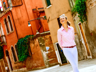Young woman walking in venice, italy