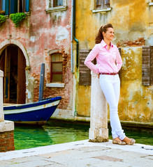 Young woman standing on street in venice, italy