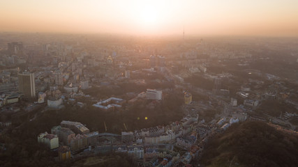Skyline bird eye aerial view of the city center with an art college and a television tower under dramatic sunset sky in Kiev, Ukraine