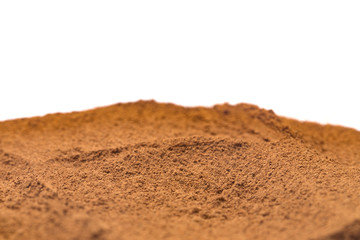 Ground Cinnamon on a White Background