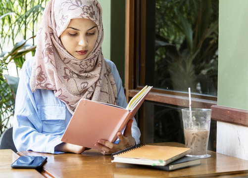 Islamic woman reading book
