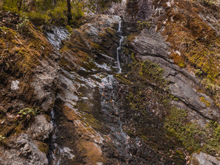 Rock wall with a little waterfall