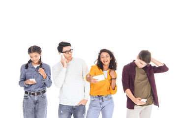 portrait of multicultural teen friends with smartphones isolated on white