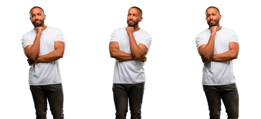 African american man with beard thinking thoughtful with smart face