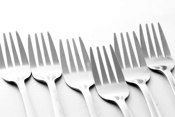 Fork / A fork, in cutlery or kitchenware, is a tool consisting of a handle with several narrow tines on one end. 