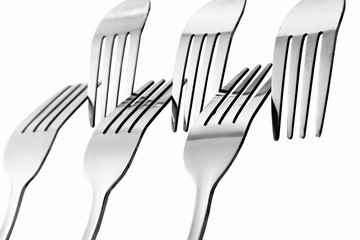Fork / A fork, in cutlery or kitchenware, is a tool consisting of a handle with several narrow...