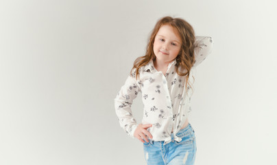 child in the Studio posing in fashionable clothes