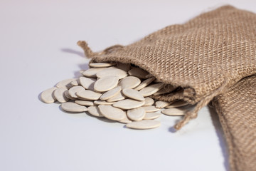 Pumpkin seed in the sack bag on the white background