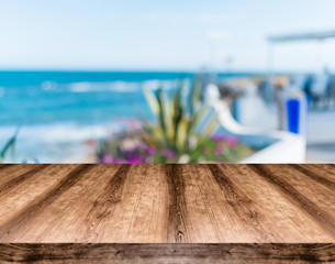 Wooden empty table board in front of blurred background. Can be used for display or montage any product. Mock up for display your product.