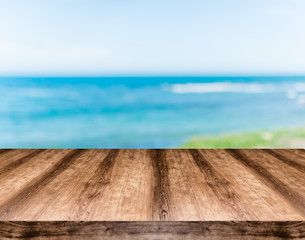 Wooden empty table board in front of blurred background. Can be used for display or montage any product. Mock up for display your product.