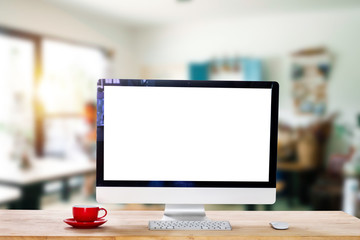Computer Monitor, Keyboard,coffee cup and Mouse with Blank or White Screen Isolated is on the work table in the coffeeshop 
