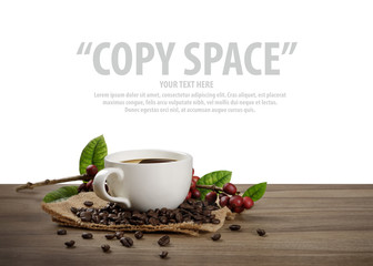 Hot coffee cup with fresh organic red coffee beans and the roasted coffee beans on the wooden table isolate in white background with copy space for your text