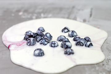 Manual cooking of frozen dessert, sweet ice cream with berries.