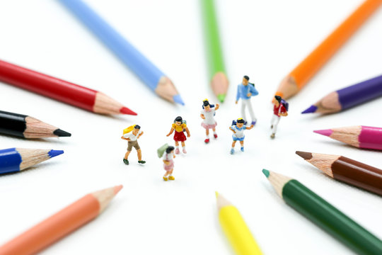 Miniature people : children and student with colorful drawing tools and stationary,education concept.