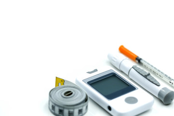 Fototapeta premium Glucose meter diabetes test and Syringe with measuring tape,concept of diabetes, healthy lifestyles and nutrition