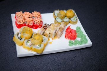 Set of sushi and maki roll on stone table. Top view with copy space
