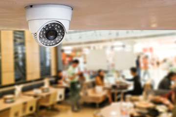 CCTV system security inside of restaurant.Surveillance camera installed on ceiling to monitor for...