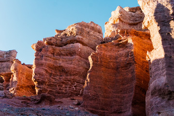 Charyn Canyon bottom view - geological formation consists of amazing big red sand stone. Charyn National Park. Kazakhstan.