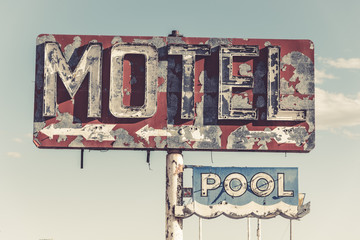 A dilapidated, classic, vintage motel sign in the desert of Arizona