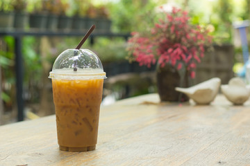 Ice coffee on a wooden table