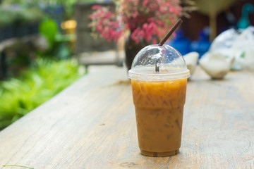 Ice coffee on a wooden table